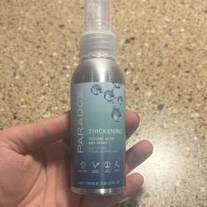 Paradox Thickening Volume Blow Dry Spray - Silver and Green